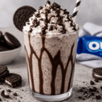 Ultimate Oreo Milkshake topped with whipped cream and cookie crumbs